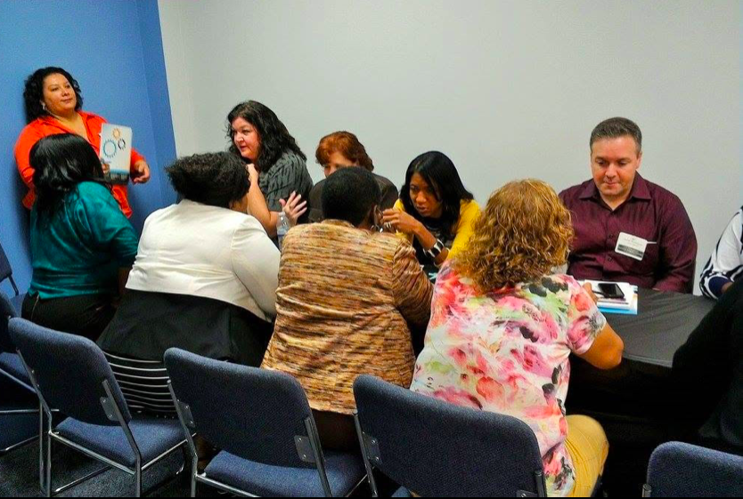Attendees working together in a small group session at SONC